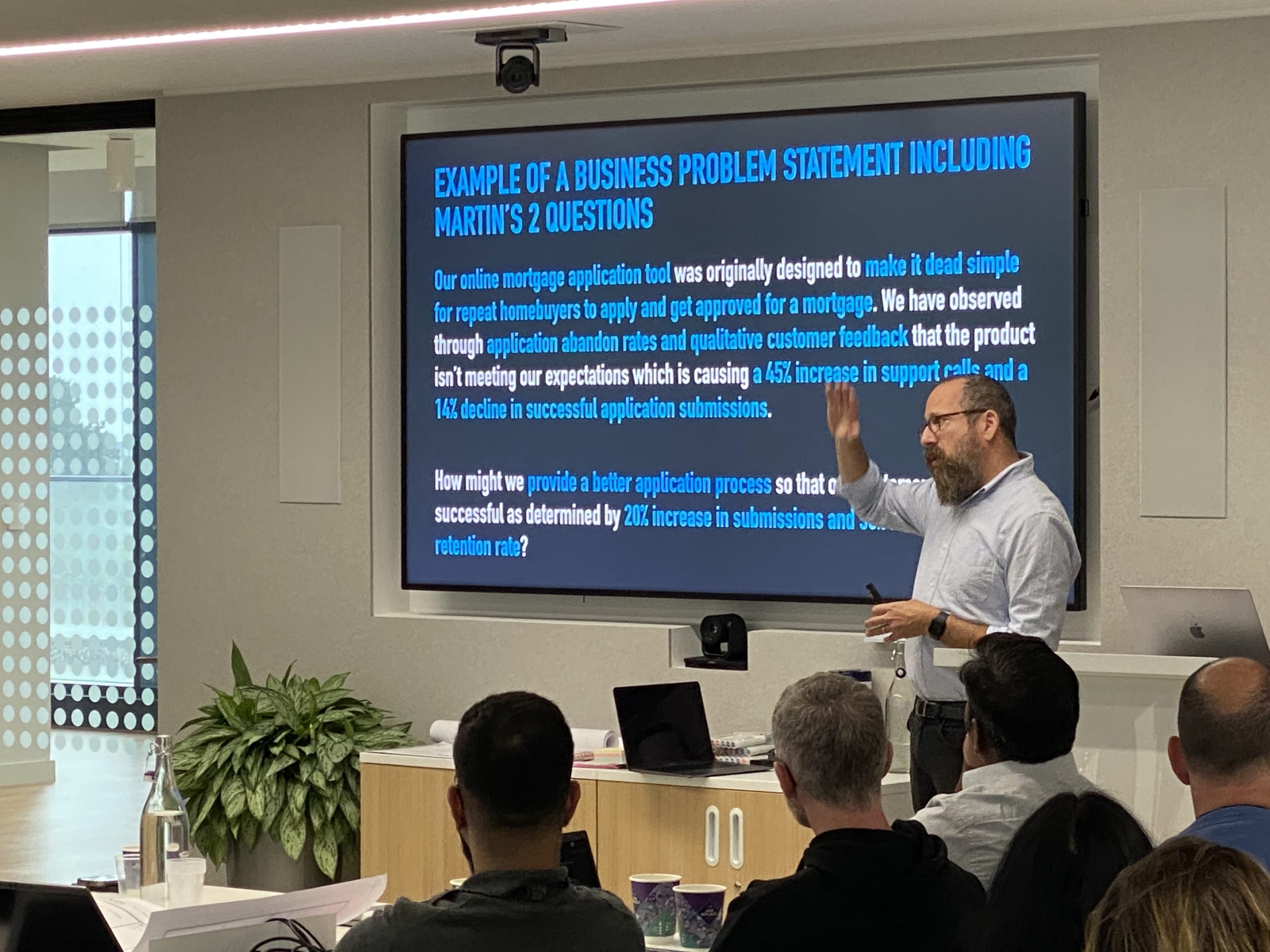 Josh Seiden teaching executives how to write a compelling business problem statement